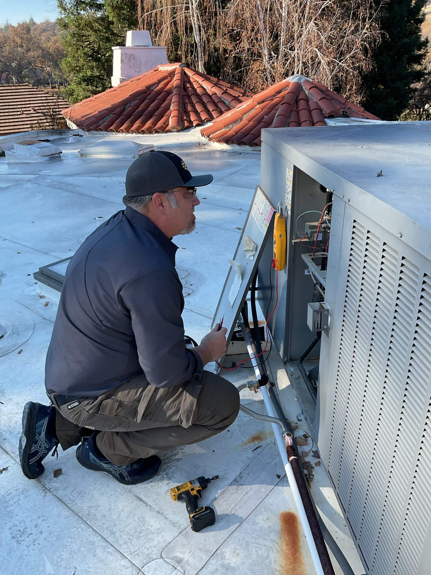 AAA electrician examining electrical equipment